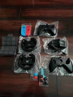 Two steering wheels and two controllers for switch thumb joy-cons  blue & red cases charging stand