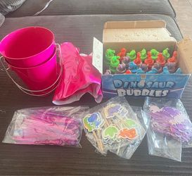 Dinosaur and pink party supplies