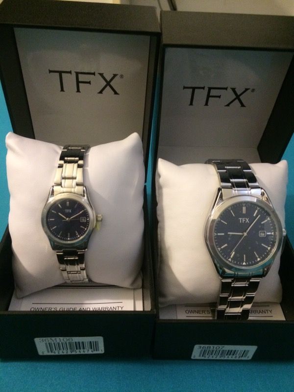 New TFX Bulova His Hers stainless steel watch set