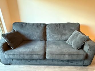 Blue couch with pillows
