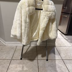This is a Off White faux fur coat. 