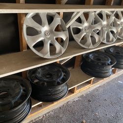 16” black wheels and Mazda factory hub caps