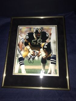Jack Lambert, 4X Pittsburgh Steeler Super Bowl Champion Autigraphed 8x10 Photo framed in Black Suede n Vintage Gold Linen Matting in a Gold Frame.