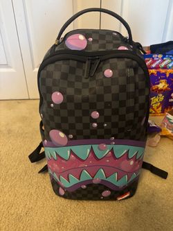 Sprayground bag comes with 5 tags