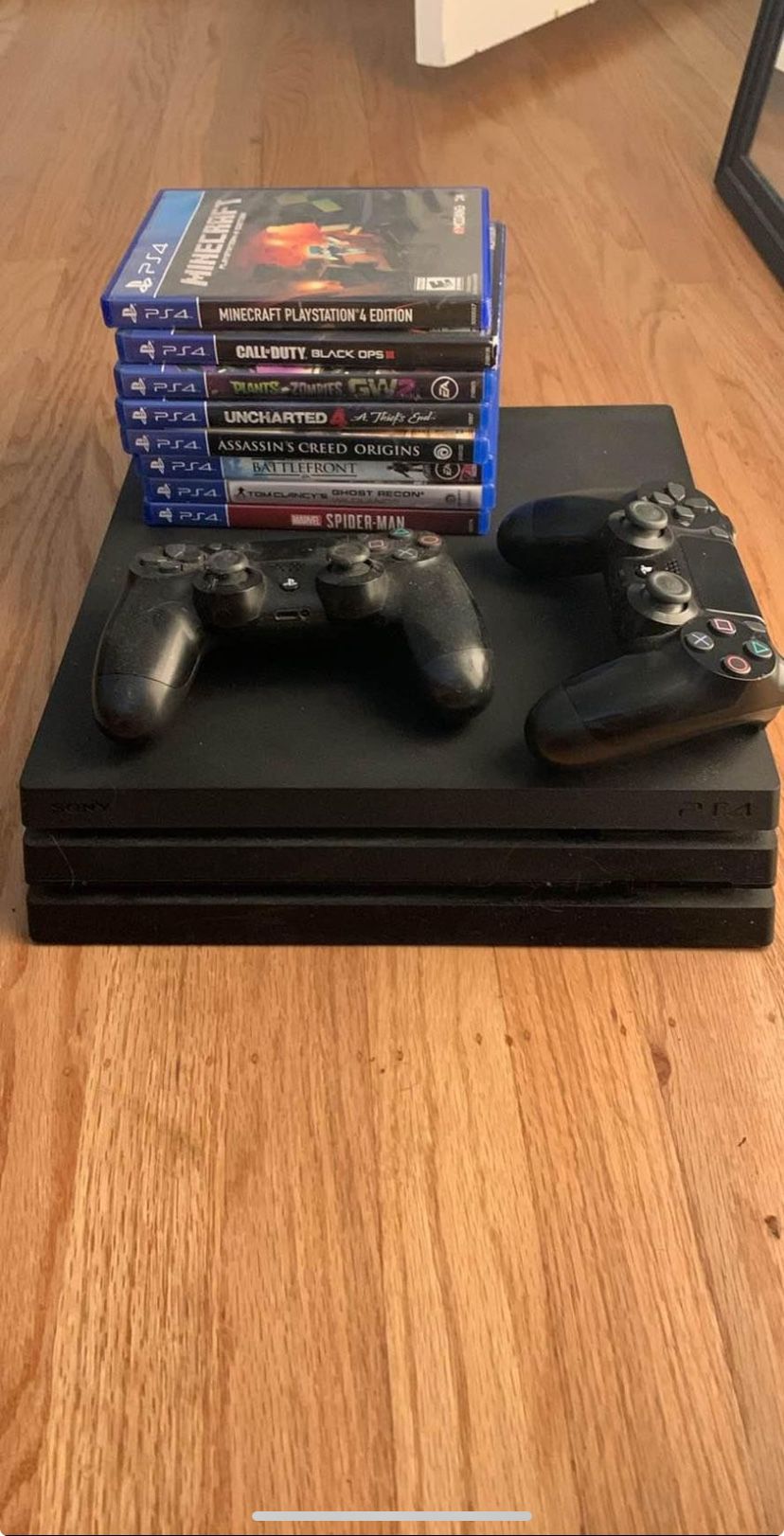PS4 Pro with Games and Controllers 