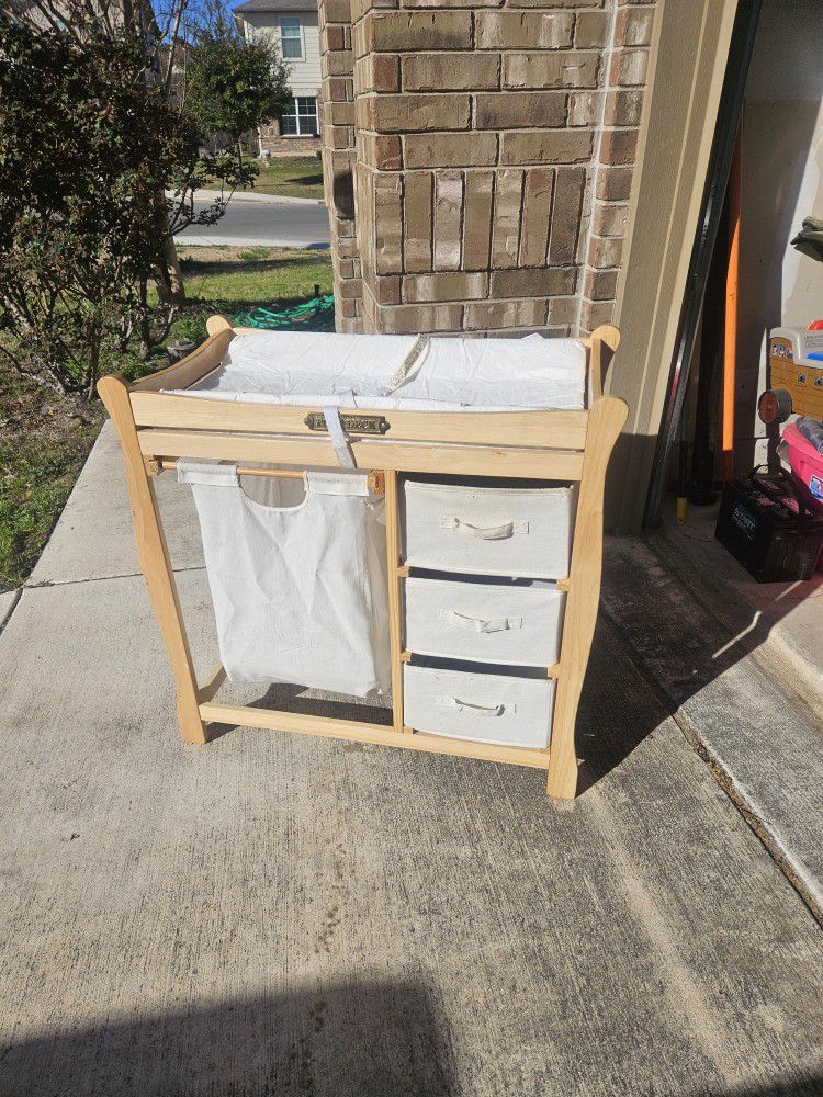 Changing table with drawers and laundry basket
