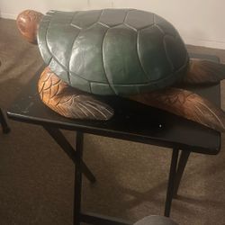 hand-carved wooden sea turtle sculpture, commonly referred to as a Hawaiian