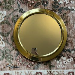 Round gold mirror