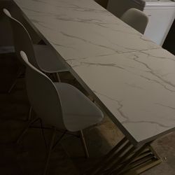 White marble table Dinner table And three Chairs