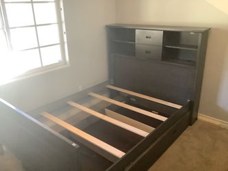 Full bed with bookshelf headboard and twin trundle.