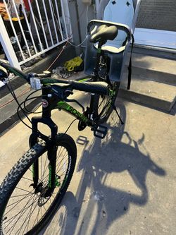 black and green Schwinn Boundary mountain bike with 29-inch wheels