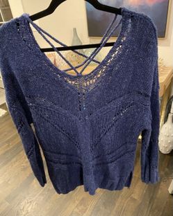 Braeve women’s blue v neck and back long sleeved sweater size medium with split sides and criss cross detail at the neck and back.