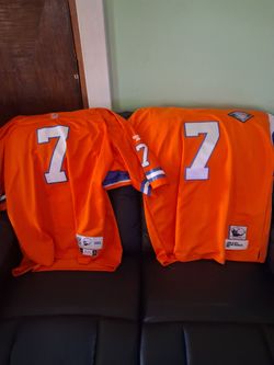 Two John Elway jerseys.
