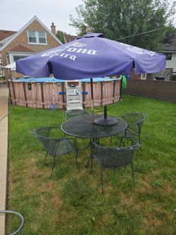 Table and chairs with umbrella