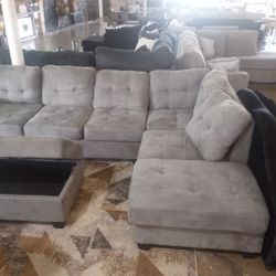 Cool Gray Reversible Sectional With Storage Ottoman ( Ask For Jose)
