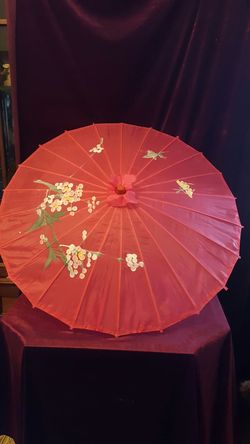 Decorative pink umbrella with floral design