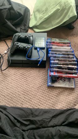 PS4 console two controllers USB hard drive 12 video games