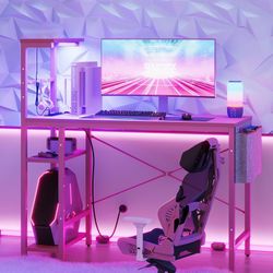 Bestier Pink Gaming Desk with Power Outlets, 44 Inch Led Gamer Desk with 4 Tiers Reversible Shelves, Computer Desk with Headset Hook & Side Storage Ba