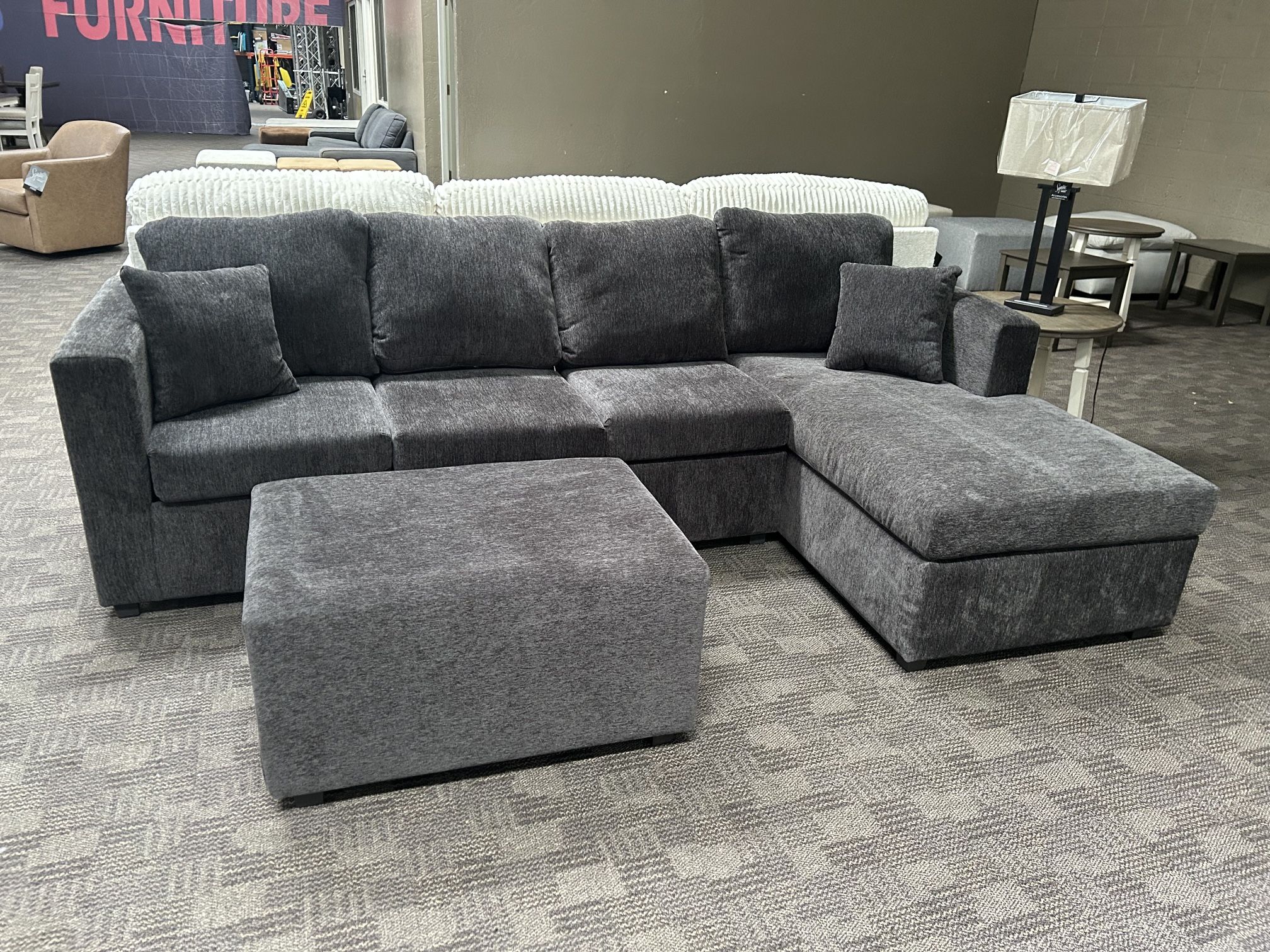 New Grey Sectional And Ottoman