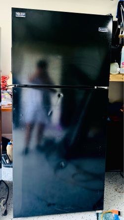 Maytag two-door black top-freezer refrigerator.