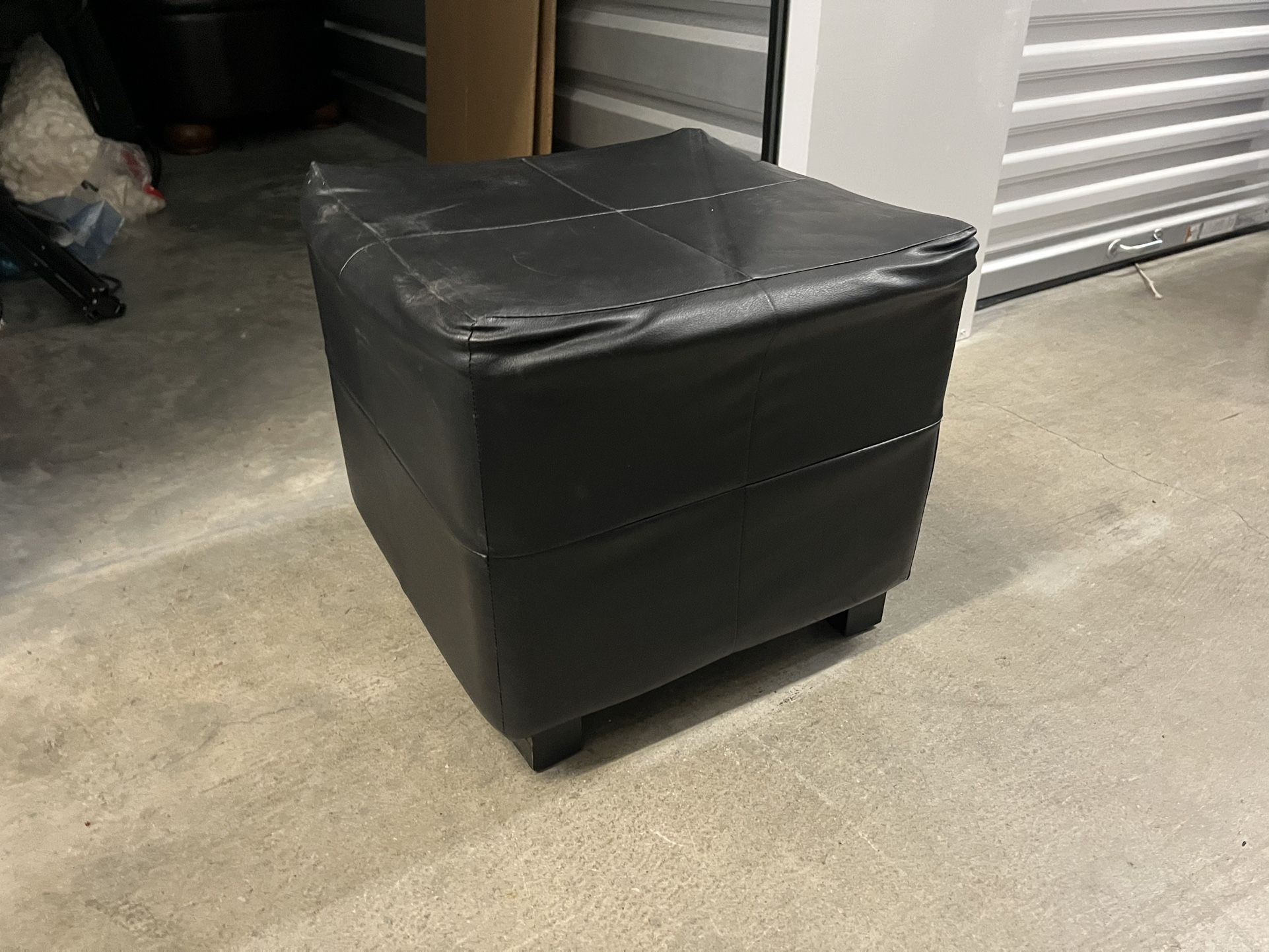 Small black ottoman