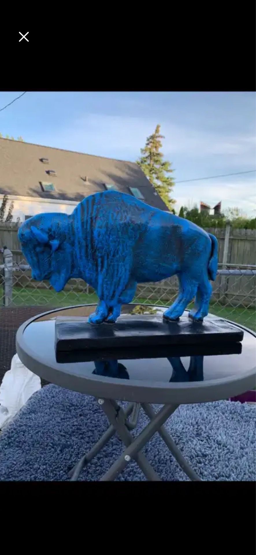 The old blue buffalo statue
