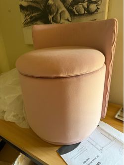 Pink round vanity-chair with storage