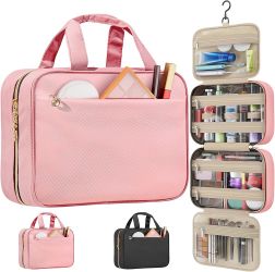 Spacious travel organizer is made of a pink water-resistant polyester fabric with a quilted texture. It has four separate compartments with clear wind