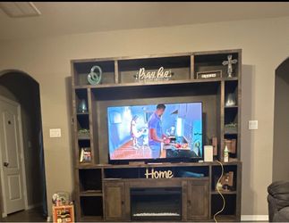 Entertainment Center with fire place/heater $900