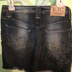 Elegant Jeans skirt.  Versace brand.  Size (28) M-L.  Made in Italy.  $60 new women's dress with original lace trim.