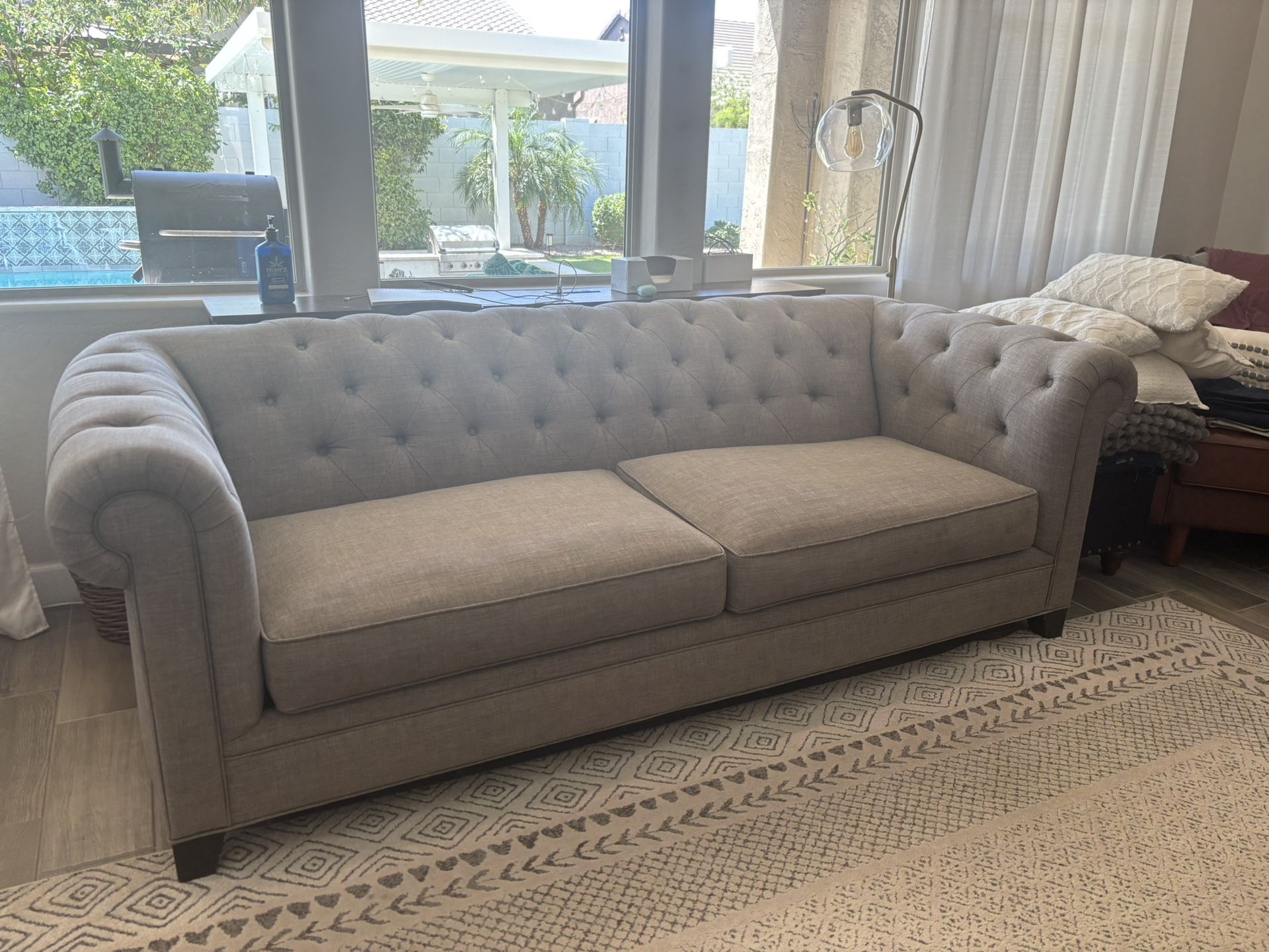 Two 94” (Brand: Living Spaces) Gray Sofas