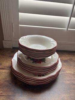 4 full sets of Christmas dishes for four.