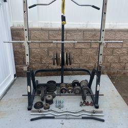 Squat Rack, Curl Bars, Straight Bars and close to 300 Lbs Of Weights