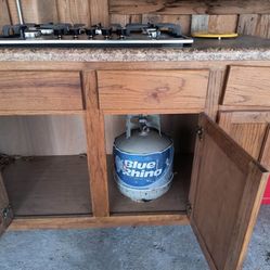 Cabinet with built in propane stove. 5 Burner.