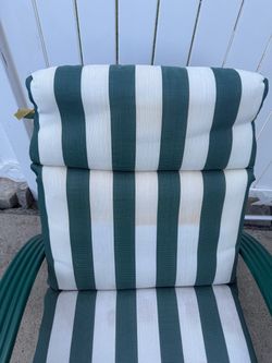 GREEN METAL ROCKING CHAIR SLIGHTLY STAINED CUSHIONS