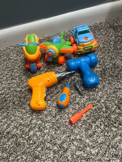 take-apart construction toy a toy motorcycle, airplane, jeep and a battery-operated drill & hammer