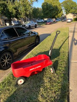 Red Radio Flyer wagon for kids.