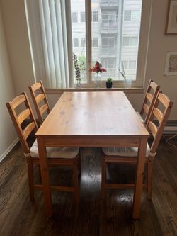 IKEA dining table with 4 chairs and cushions
