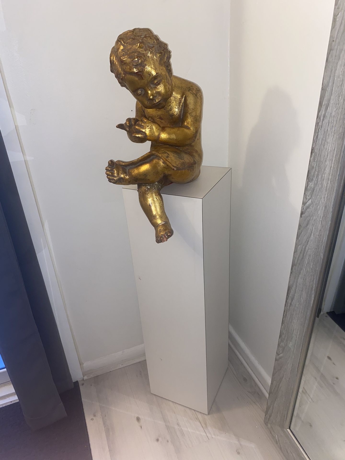 Gold Statue & White Pedastal