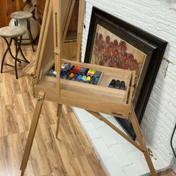 Easel with acrylic paints 