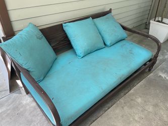 Wooden daybed with cushions