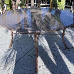 Iron patio table with granite top