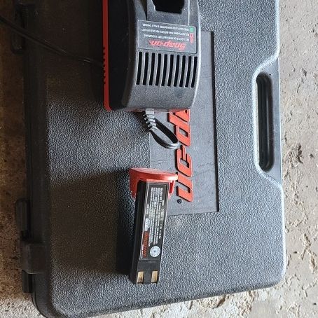 Snap On Battery, Charger and case. Not sure what's the battery for