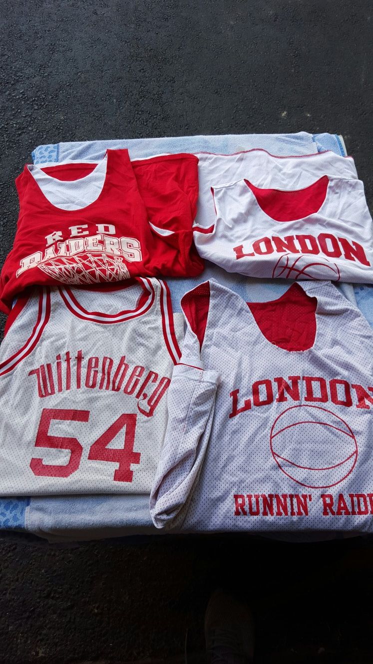 Assorted basketball jerseys and shorts
