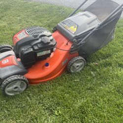 Husqvarna AWD Self Propelled Mower 163cc Engine With 21” Cutting Deck And Bag. Must Pickup