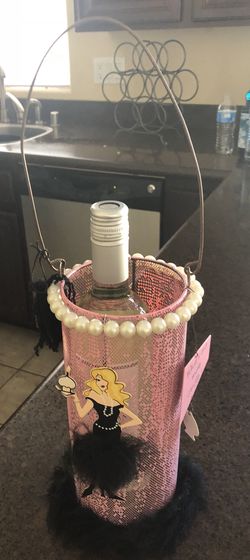 Novelty medal wine holder, pink with blonde cartoon character, pearls and fur