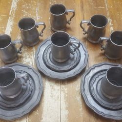 Midevil Crown castle LTD eight-piece pewter dish set.