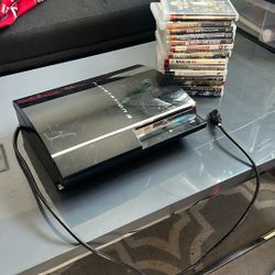 PS3 With Power Cord And Games 