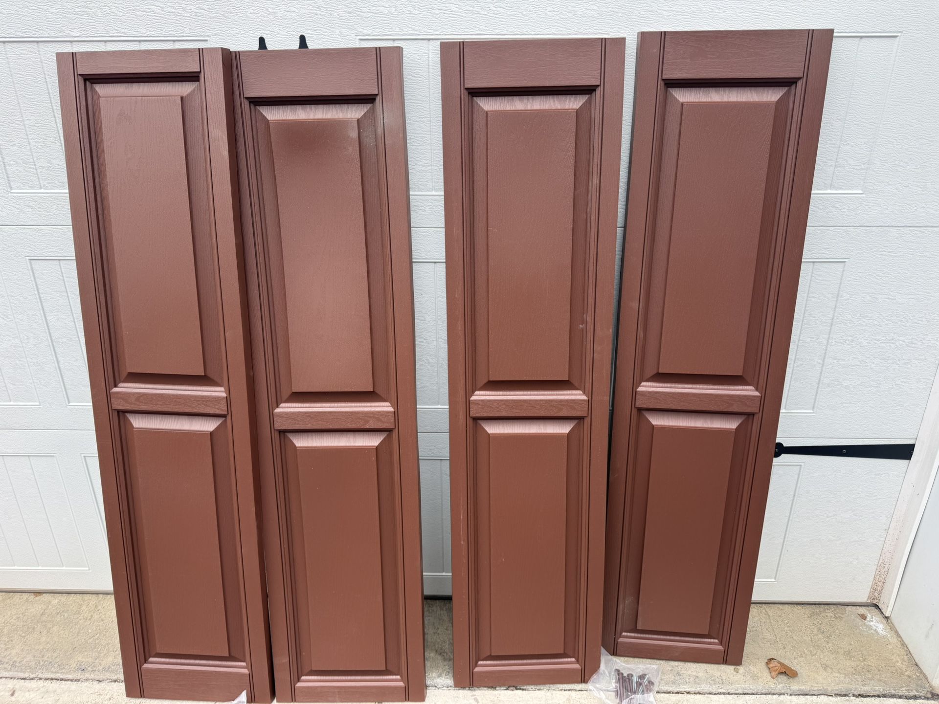 New (2) Sets Terra Brown Vinyl Shutters 15”x 59” $20 A Set. Must Pickup