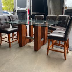Wooden glass dining table with six real leather chairs